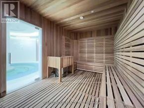 Toronto (Bay Street Corridor) condo for rent - A sauna room with wooden walls and flooring.