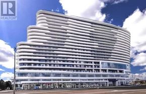 Mississauga (Central Erin Mills) condo for rent - A modern building with a glass facade and a sign that reads "REALTOR".