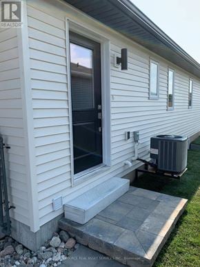 Belleville (Belleville Ward) apartment for rent - A house with a realtor sign on the side.