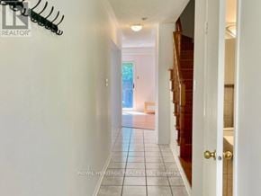 Pickering (Highbush) townhouse for rent - A hallway with a white door and a sign that says "REALTOR".