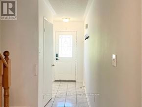 Pickering (Highbush) townhouse for rent - A hallway with a door at the end.