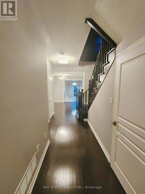 Vaughan (Vellore Village) townhouse for rent - A long hallway with a staircase on the right side.