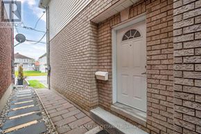 Ottawa apartment for rent - A white door is on a brick wall.