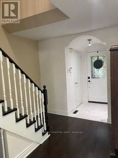 Whitby (Pringle Creek) townhouse for rent - A hallway with a staircase and a door.
