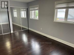 Whitby (Pringle Creek) townhouse for rent - A room with wooden floors and a window.