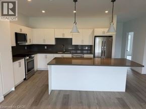Hamilton apartment for rent - A modern kitchen with a large island in the center.