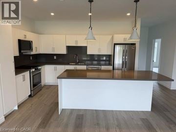 Hamilton apartment for rent - A modern kitchen with a large island in the center.