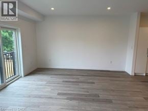 Hamilton apartment for rent - A room with a wooden floor and white walls.