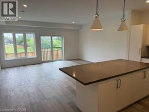 Hamilton apartment for rent - A spacious kitchen with a large island and pendant lights.
