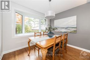 Ottawa apartment for rent - A dining room with a wooden table and chairs.
