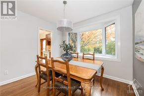 Ottawa apartment for rent - A dining room with a wooden table and chairs.