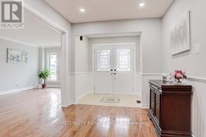 Richmond Hill (Devonsleigh) apartment for rent - A hallway with a wooden floor and white walls.