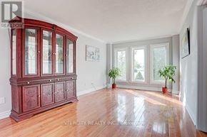 Richmond Hill (Devonsleigh) apartment for rent - A room with a wooden floor and a large wooden cabinet.
