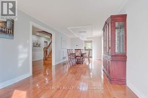 Richmond Hill (Devonsleigh) apartment for rent - A large room with a wooden floor and a red cabinet.