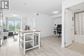 Toronto (Yorkdale-Glen Park) condo for rent - A spacious living room with a kitchenette and a dining area.