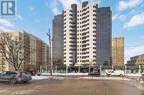 London East (East F) condo for rent - A building with the words "TEAM GLASSER REAL ESTATE BROKERAGE INC." on the bottom.