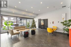 London East (East F) condo for rent - A modern living room with a glass door and a Christmas tree.