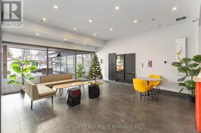 London East (East F) condo for rent - A modern living room with a glass door and a Christmas tree.