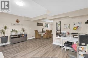 Windsor duplex for rent - A living room with a white couch and a wooden floor.