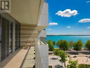 Toronto (Waterfront Communities) condo for rent - A balcony overlooks a beach from a high-rise building.