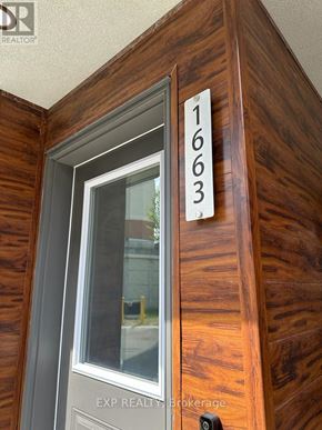 Oshawa (Samac) apartment for rent - A wooden door with the number 1663 on it.