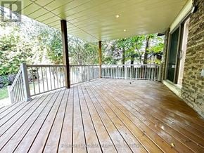 Markham (Unionville) apartment for rent - A wooden deck with a white ceiling and a brick wall.