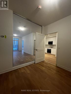 Vaughan (Concord) condo for rent - A brokerage sign is on the wall in a white room.