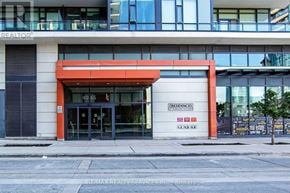 Mississauga (City Centre) condo for rent - The front of a building with a large glass window and a red awning.