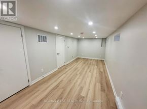 Toronto (Weston) apartment for rent - A room with wooden flooring and white walls, with a brokerage logo in the corner.