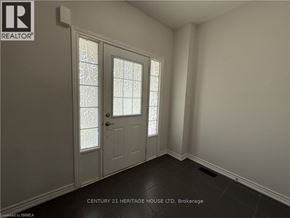 Brantford apartment for rent - A room with a door and a window with a glass pane.