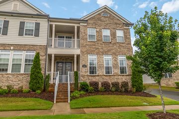 Charlotte apartment for rent - A two-story brick house with a balcony on the second floor.