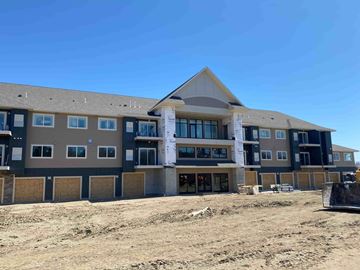 Elko New Market apartment for rent - A large building under construction with a clear blue sky in the background.