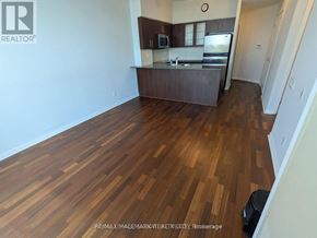 Toronto (High Park-Swansea) condo for rent - A kitchen with a refrigerator, microwave, and oven.