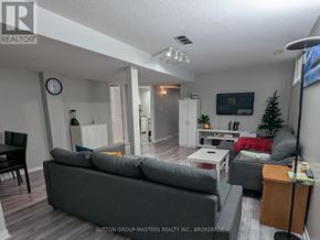 Kingston (Kingston East (Incl Barret Crt)) apartment for rent - A living room with a grey couch and a wooden cabinet.
