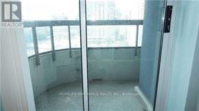Toronto (Willowdale East) condo for rent - A glass door with a handle is open.