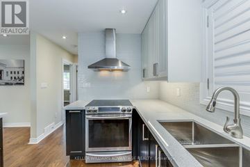 Toronto (Birchcliffe-Cliffside) apartment for rent - A modern kitchen with a stainless steel oven and a stainless steel sink.