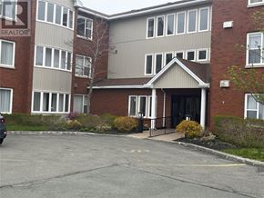 St John's house for rent - A building with a sign that says REALTOR in the window.