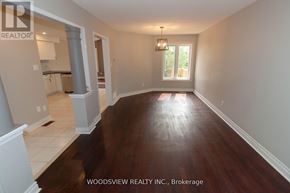 Aurora (Bayview Wellington) apartment for rent - A large empty room with wood flooring and a chandelier.