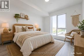 Toronto (Dovercourt-Wallace Emerson-Junction) condo for rent - A bedroom with a large bed, a chair, and a window.
