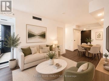 Toronto (North St. James Town) condo for rent - A modern living room with a large painting on the wall and a dining area in the background.