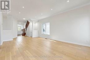 Newmarket (Woodland Hill) apartment for rent - A spacious room with wooden flooring and white walls.