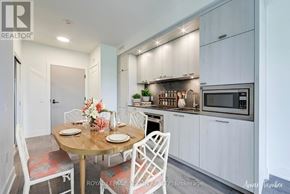 Toronto (Dovercourt-Wallace Emerson-Junction) condo for rent - A white kitchen with a table set for two.