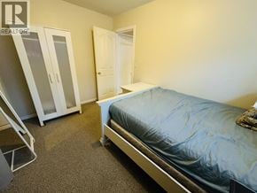 Vancouver apartment for rent - A bedroom with a bed, a wardrobe, and a dresser.
