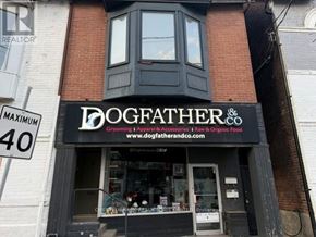 Toronto (Annex) apartment for rent - A storefront with a sign that reads "DOGFATHER & CO" sells grooming, apparel, and accessories.