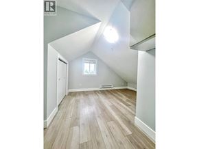 Vancouver apartment for rent - A room with wooden flooring and a window.