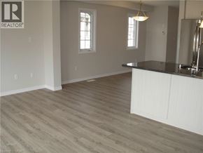 Kitchener townhouse for rent - A room with a large island and a window.