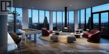 Toronto (Dovercourt-Wallace Emerson-Junction) condo for rent - A living room with a pool table and a fireplace.