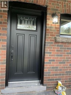 Hamilton apartment for rent - A black door with a glass window above it.