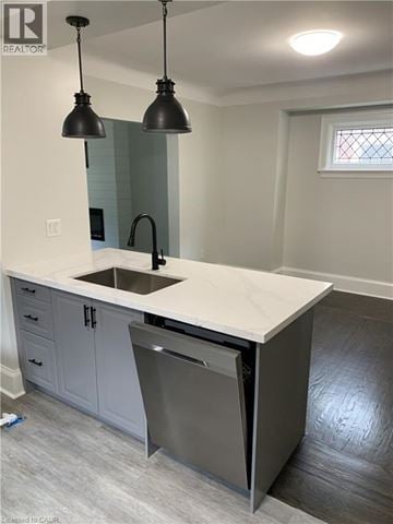Hamilton apartment for rent - A kitchen with a white counter top and a dishwasher.