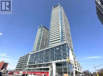 Toronto (Newtonbrook East) condo for rent - A modern glass skyscraper with a unique design stands tall against a clear sky.